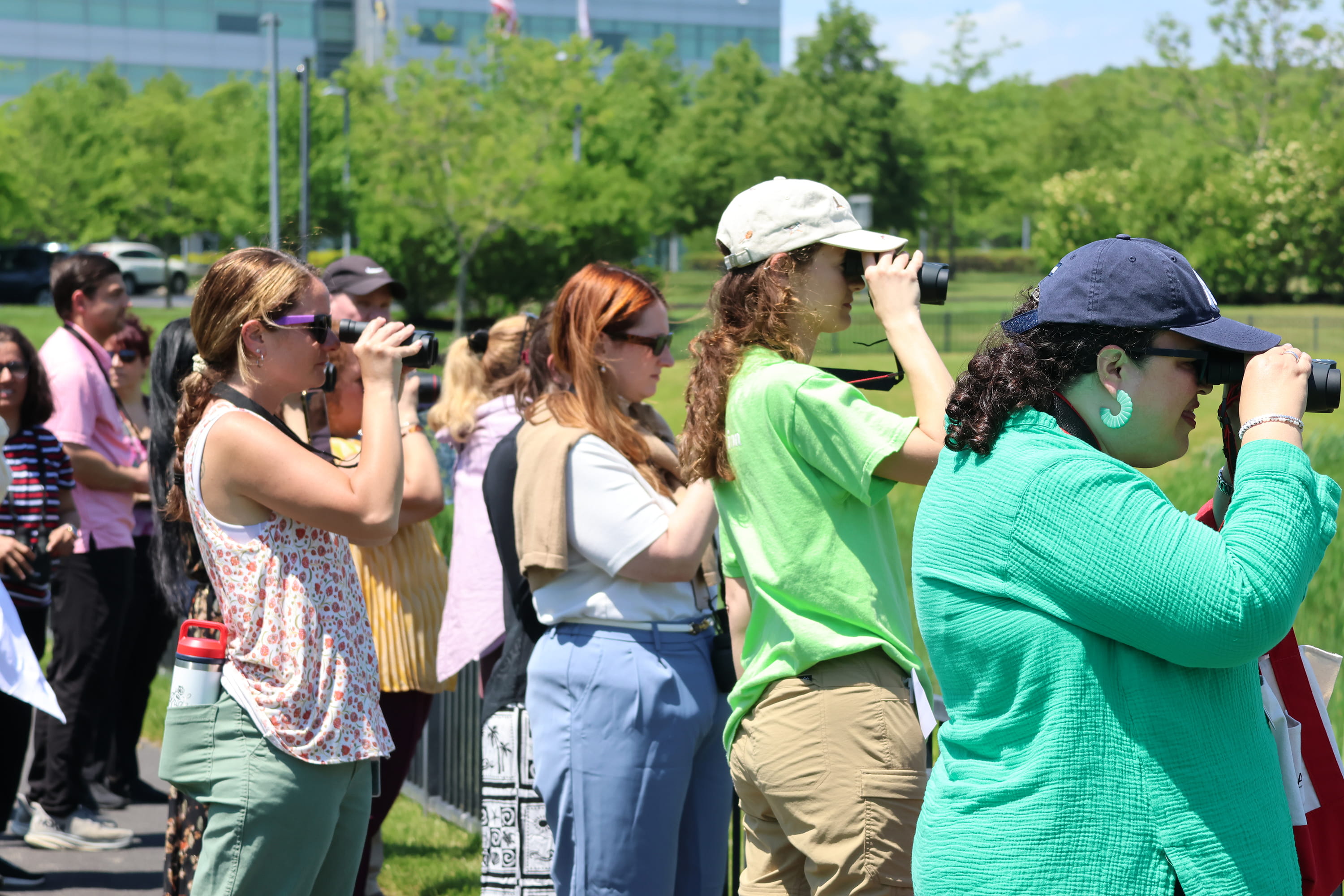 Canon Employees Looking at Birds