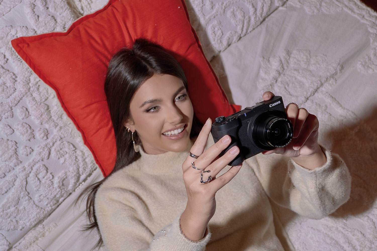 Person Laying Down Holding a Camera