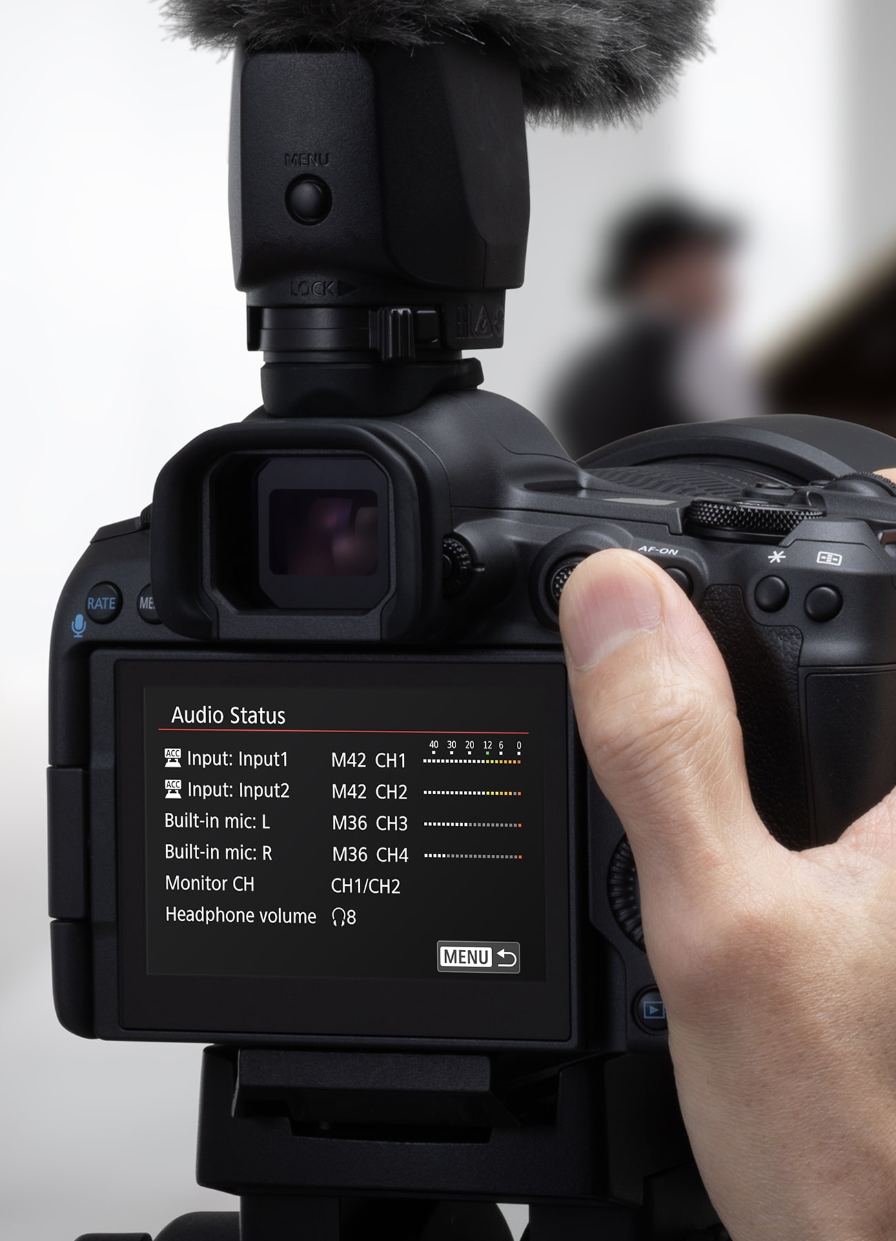 Person Holding EOS R50 Mark II